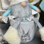 Gnome in a pot with a rabbit on it